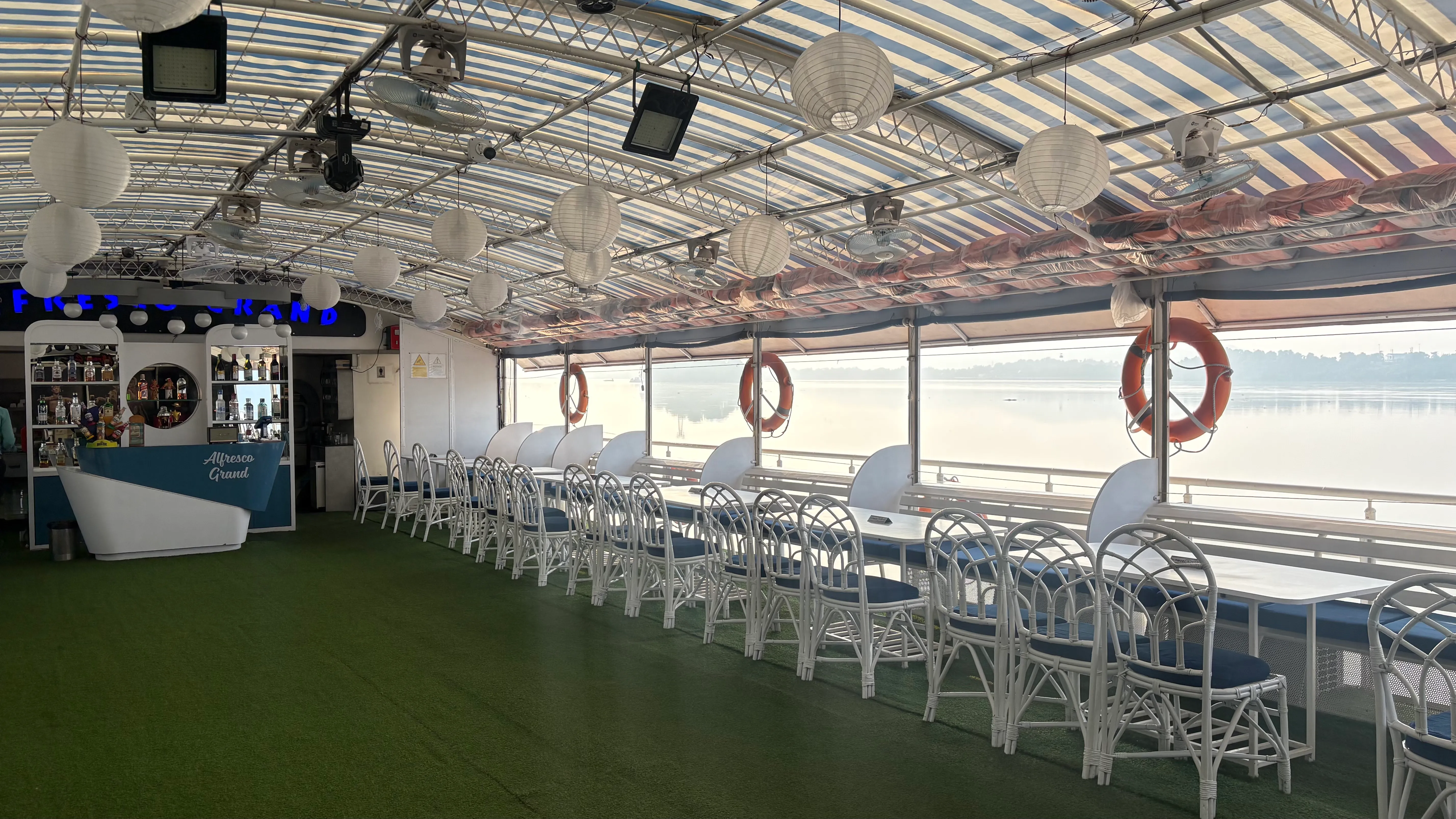 Roofed middle deck with bar and open river views