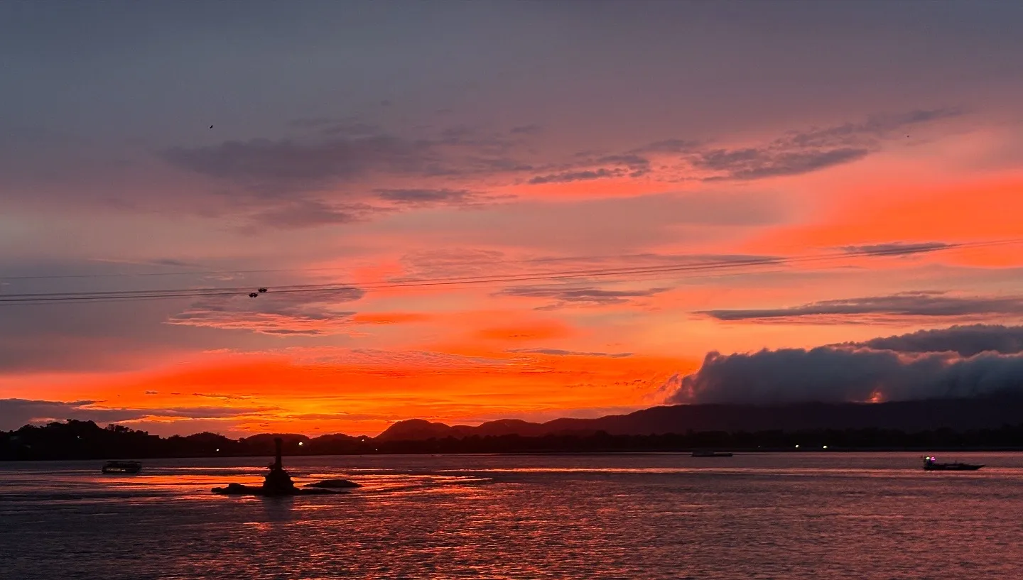 Red and orange sunset sky over the Brahmaputra river in Guwahati