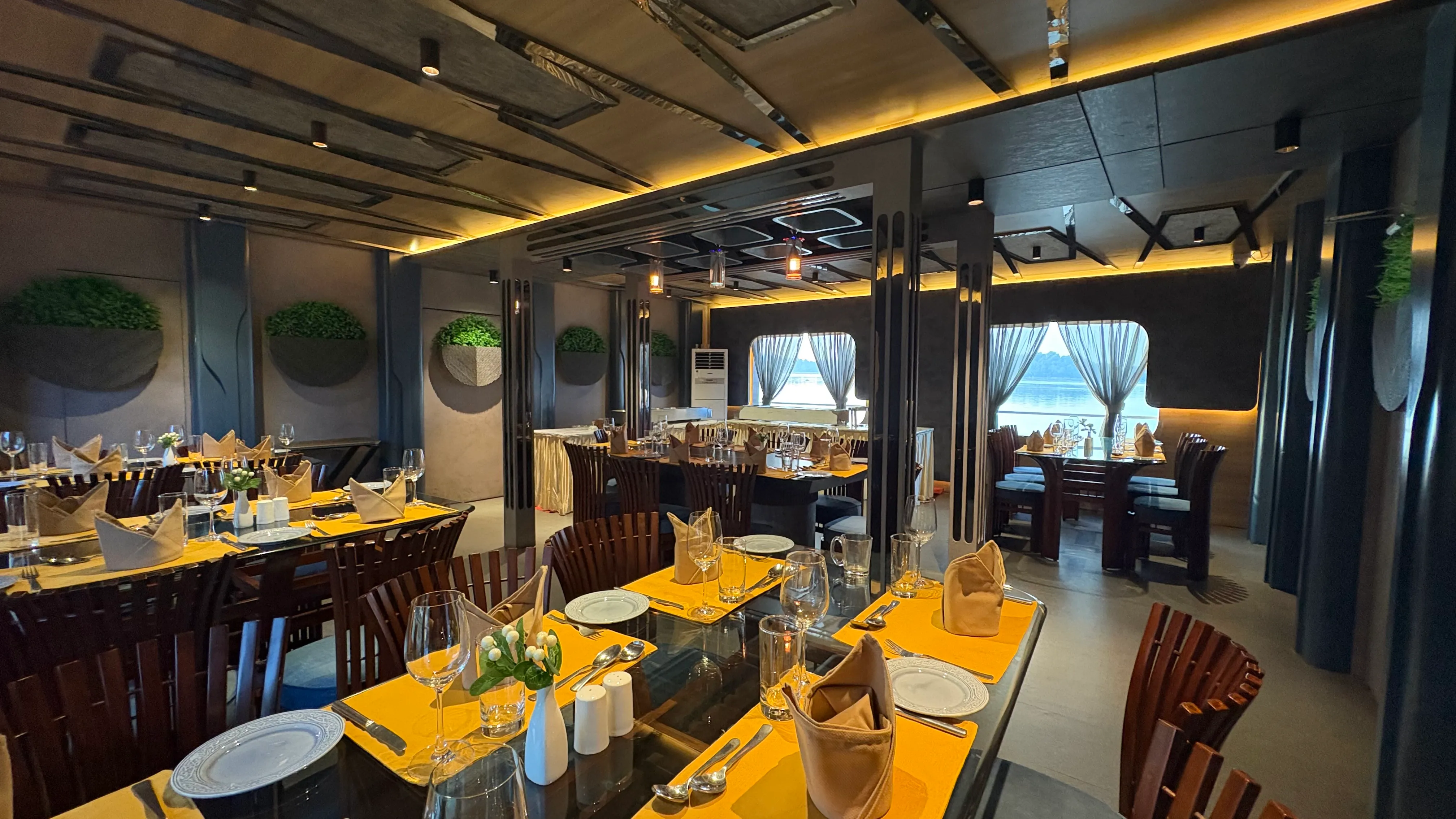Dining hall aboard Alfresco Grand with the river through the windows