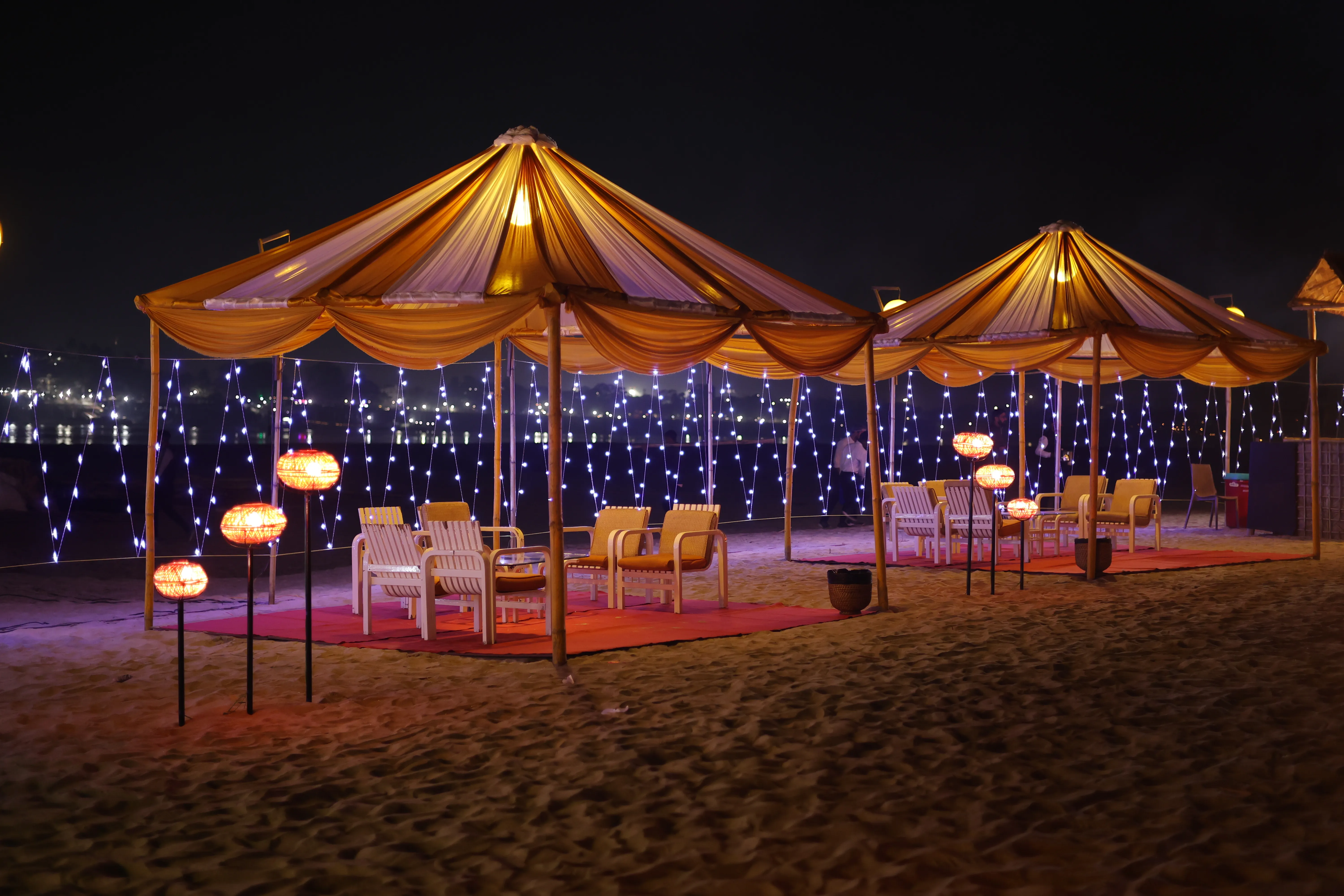 Lounge cabanas set on the sand for island guests
